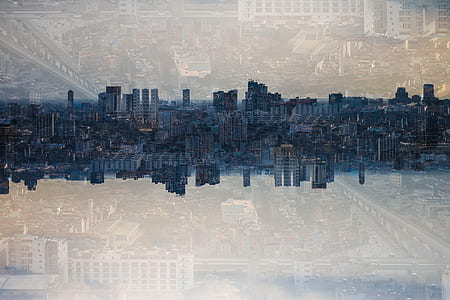 reflective photography of buildings thumbnail