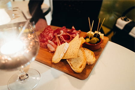 meat and bread dish served on wooden board thumbnail