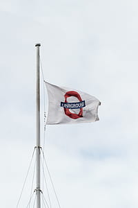 LONDON, UNITED KINGDOM - AUGUST 20, 2017 The london underground logo flying on flags in London, taken on August 20, 2017 in London. thumbnail