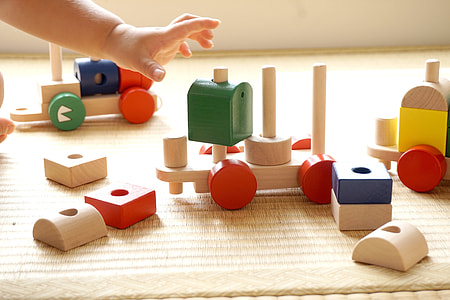 brown, red, and green wooden building blocks thumbnail