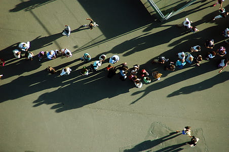 group of people on gray road thumbnail
