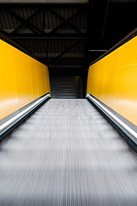 escalator with yellow walls thumbnail
