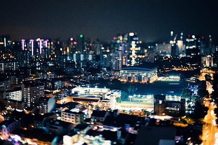 aerial photo of cityscape during night thumbnail