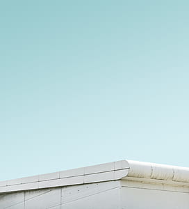 white building under clear blue sky during daytime thumbnail