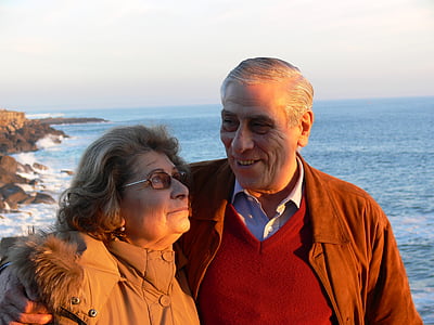 man and woman near body of water thumbnail