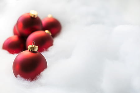 Red Ornaments On White Snow Photo thumbnail