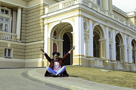 Photo of Woman Sitting on Ground thumbnail