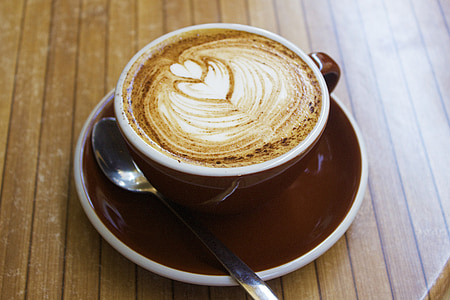 cappuccino cup on red saucer with teaspoon thumbnail
