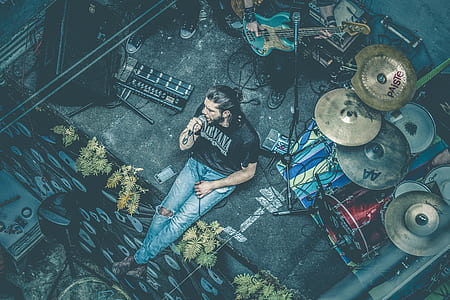 man holding microphone on stage thumbnail