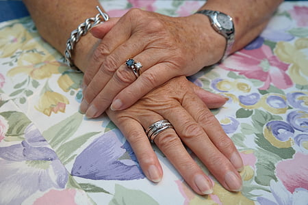 woman wearing three silver-colored rings, link bracelet, and watch thumbnail