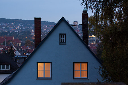 photography of white concrete house near green trees thumbnail