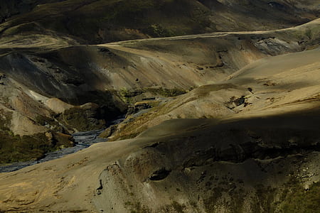brown hill during daytime thumbnail