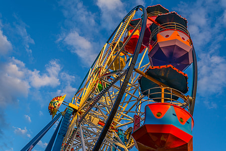 low angle photography of red, yellow, and gray Ferris wheel thumbnail