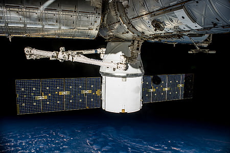gray and black satellite facing Earth thumbnail