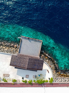 aerial photo of house near the body of water thumbnail