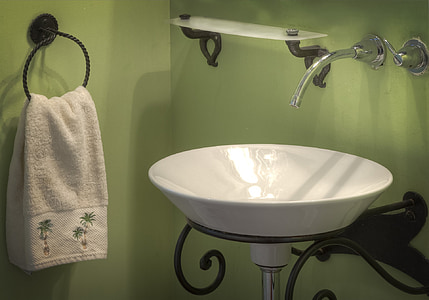round white ceramic sink near white towel thumbnail