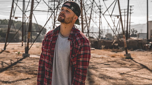 man wearing gray shirt and red flannel thumbnail