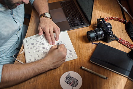 man writing on paper thumbnail