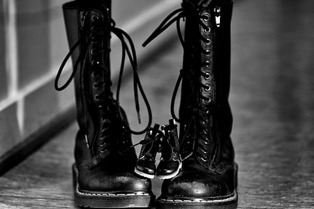 pair of black leather combat boots in grayscale photography thumbnail