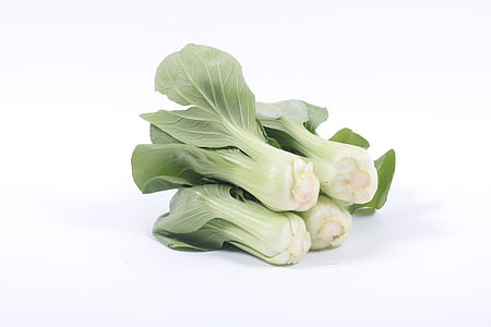 photo of bunch of bokchoy on white surface thumbnail