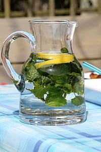 pitcher of water with sliced lemon thumbnail