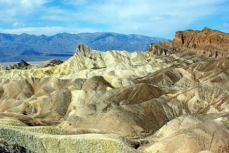 brown mountains under blue sky thumbnail