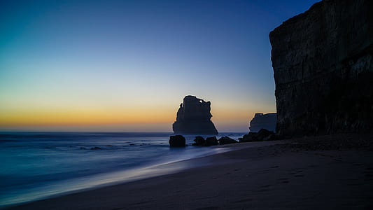 photograph of hills beside seashore thumbnail