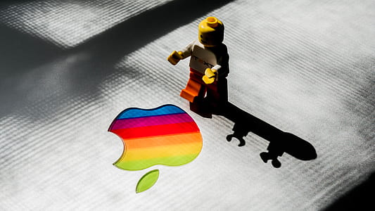 yellow, white, and red minifig near multicolored apple log thumbnail