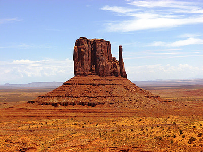 brown rock formation under cloudy sky thumbnail