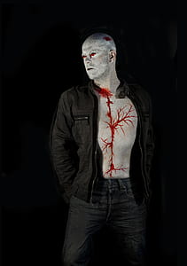man in black jacket showing blood on his body thumbnail
