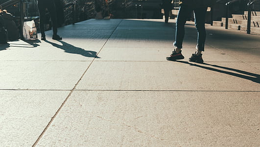 person standing on pavement thumbnail
