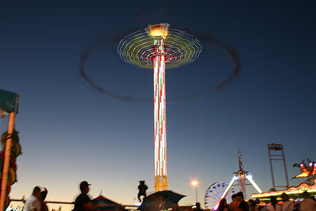 people near carousel tower thumbnail