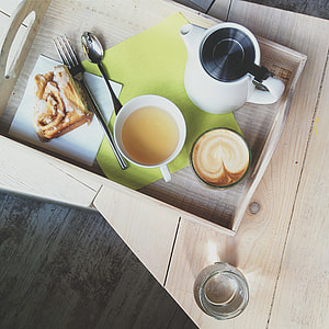 Cappuccino, tea and cinnamon roll thumbnail
