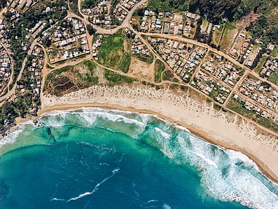 aerial photo of town near beach thumbnail