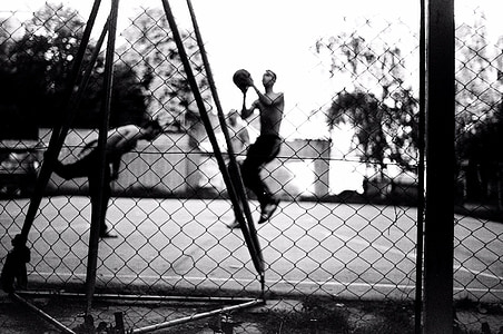 greyscale photography of men playing basketball in the court thumbnail