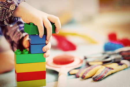person holding LEGO blocks thumbnail