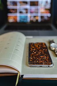 Home office desk with Macbook, iPhone, calendar, watch & organizer thumbnail