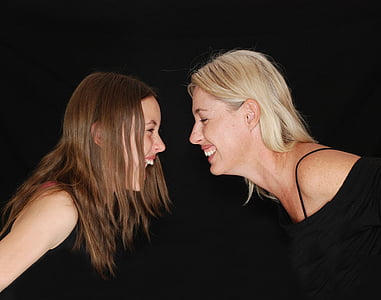 two women smiling at each other thumbnail