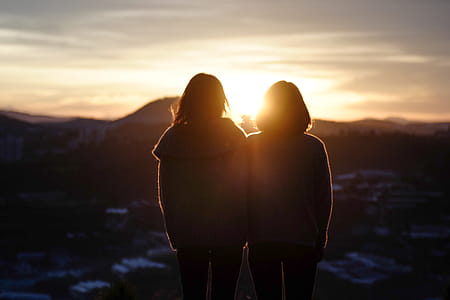 Silhouette of Two Woman Standing thumbnail