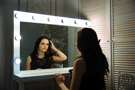 woman looking on vanity mirror thumbnail