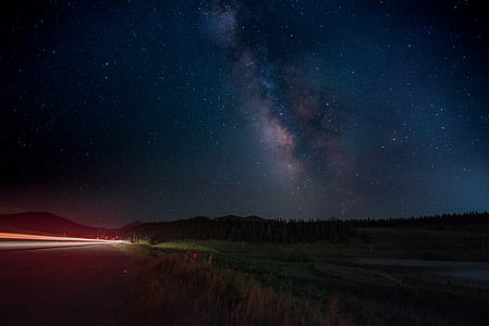 landscape photography of space clouds during nighttime thumbnail