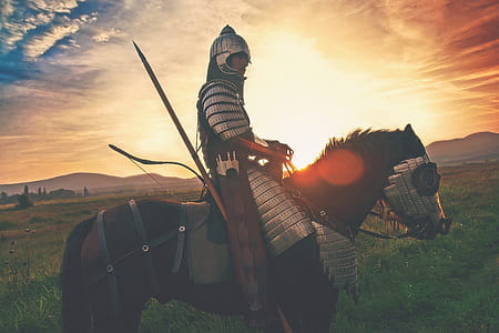 man riding horse during golden hour thumbnail