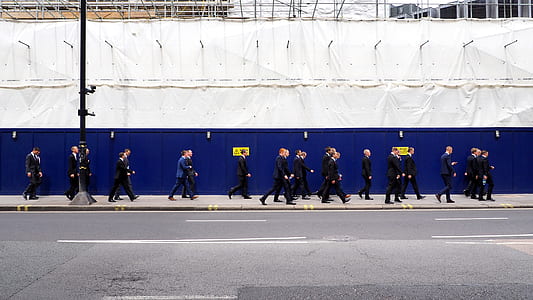 men walking across the hallway thumbnail