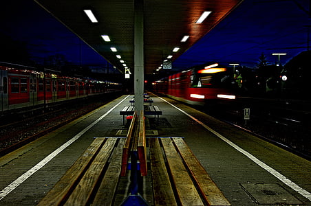 brown bench beside train thumbnail