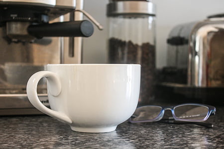 white ceramic teacup beside eyeglasses thumbnail
