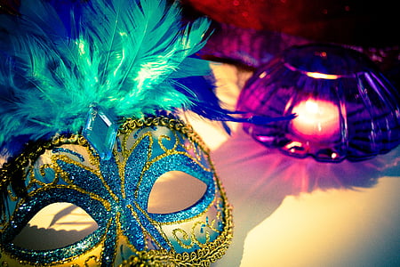 yellow and blue masquerade beside purple glass candle holder thumbnail