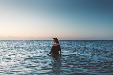 woman in blue ocean water taken at daytime thumbnail