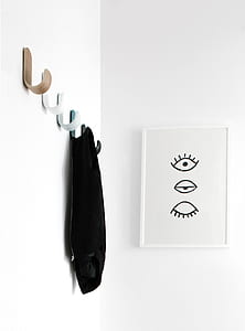 black cloth on wall near painting thumbnail