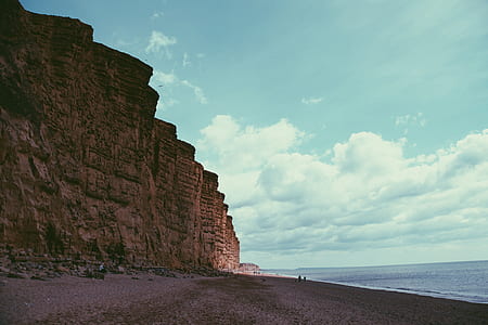 beach with mountain on side thumbnail
