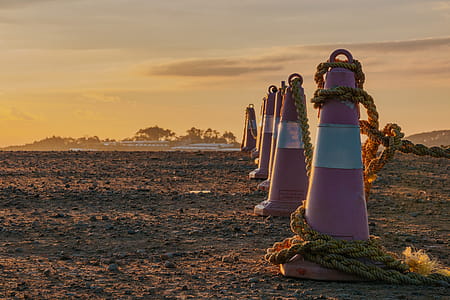 Photo of Traffic Cones with Ropes During Dusk thumbnail